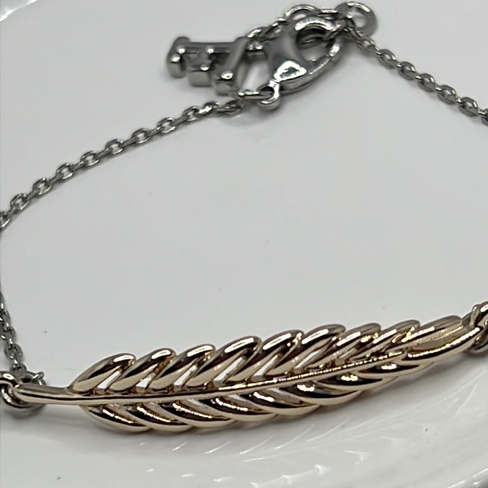 NWT French Connection Mixed Metal Feather Bracelet.